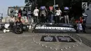 Aktivis menggelar aksi Renungan 10 Tahun Undang-Undang Narkotika di Jakarta, Selasa (25/6/2019). Undang-Undang No.35 Tahun 2009 tentang Narkotika dinilai menjadi alat memenjarakan pengguna secara masif serta menembak mati mereka yang diduga terlibat perdagangan narkoba. (merdeka.com/Iqbal S Nugroho)
