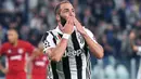 Penyerang Juventus, Gonzalo Higuain mencetak satu gol untuk kemenangan timnya atas Olympiakos pada laga grup D Liga Champions di Allianz stadium, Turin, (27/9/2017). Juventus menang 2-0. (Alessandro Di Marco/ANSA via AP)