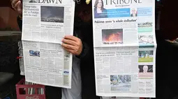 Kesepakatan gencatan senjata berlaku segera mulai Hari ini, Rabu 8 April 2026, dan mencakup wilayah konflik, termasuk Lebanon. Tampak dalam foto, seorang pedagang memajang koran pagi di kios pinggir jalannya di Islamabad, Pakistan, pada Rabu 8 April 2026. (Aamir QURESHI/AFP)