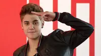 Justin Bieber dikabarkan masih belum bisa melupakan Selena Gomez meski telah menggandeng wanita lain (AP Files)