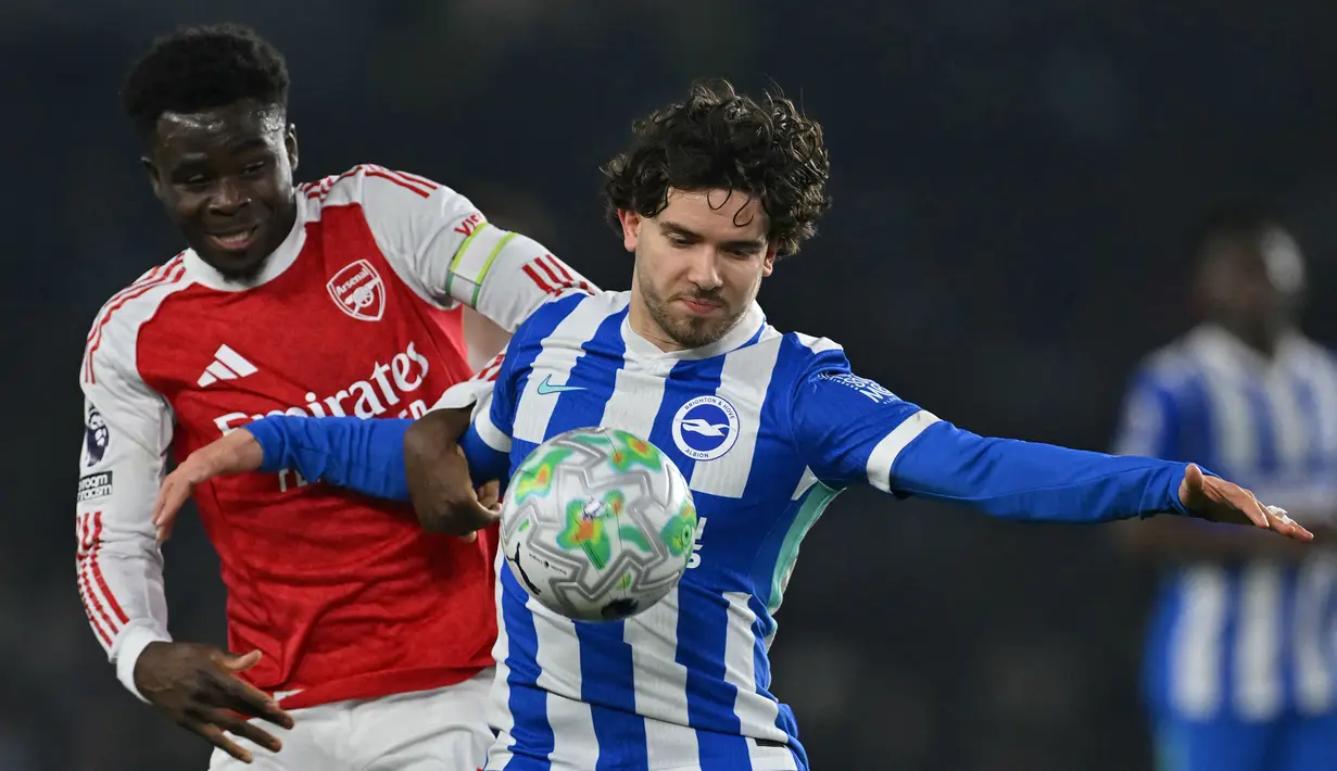 The Gunners menang dengan skor tipis 1-0 melalui gol semata wayang Bukayo Saka pada menit kesembilan. (AFP/Glyn Kirk)