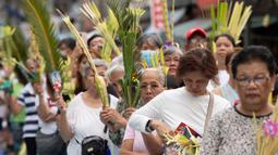Minggu Palma menjadi bagian tak terpisahkan dari Pekan Suci yang mempersiapkan umat Kristiani untuk perayaan Paskah, kebangkitan Yesus Kristus. (Ted ALJIBE/AFP)