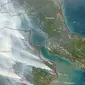 Lewat bidikan kamera MODIS yang disematkan di satelit Terra, NASA memperlihatkan tebalnya kabut asap yang menyelimuti wilayah Riau