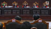 Suasana sidang ke-5 sengketa Pilpres 2019 di Gedung Mahkamah Konstitusi (MK), Jakarta, Jumat (21/6/2019). Sidang tersebut beragendakan mendengar keterangan saksi dan ahli dari pihak terkait yakni paslon nomor urut 01 Joko Widodo (Jokowi)-Ma'ruf Amin. (Liputan6.com/Johan Tallo)