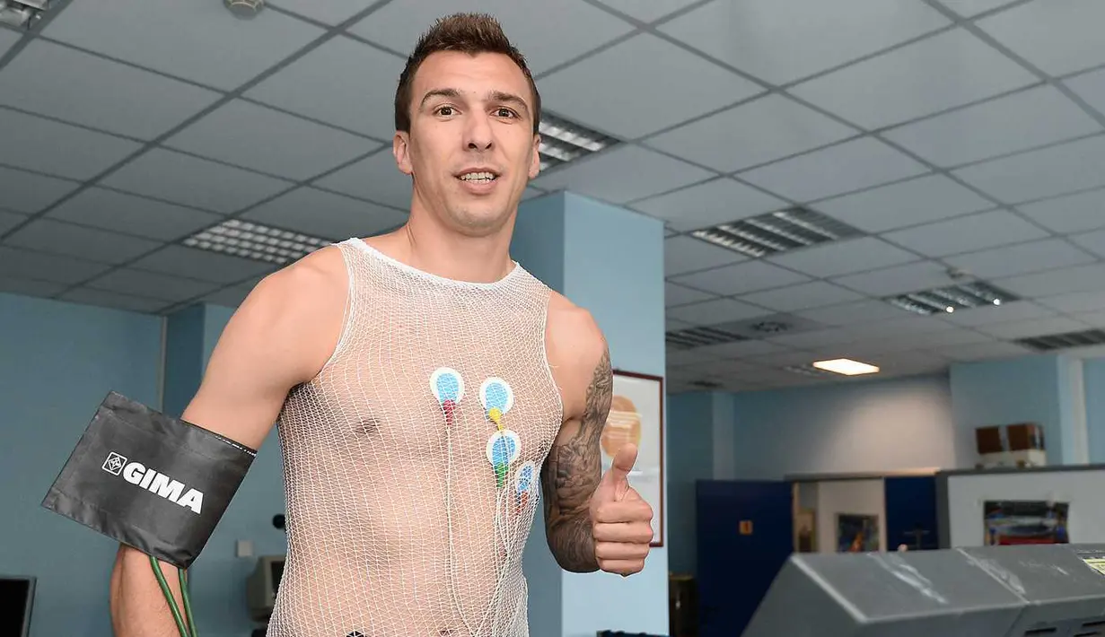 Striker Kroasia, Mario Mandzukic tiba di markas Juventus di Turin untuk menandatangani kontrak dan menjalani tes medis. (Juventus.com)