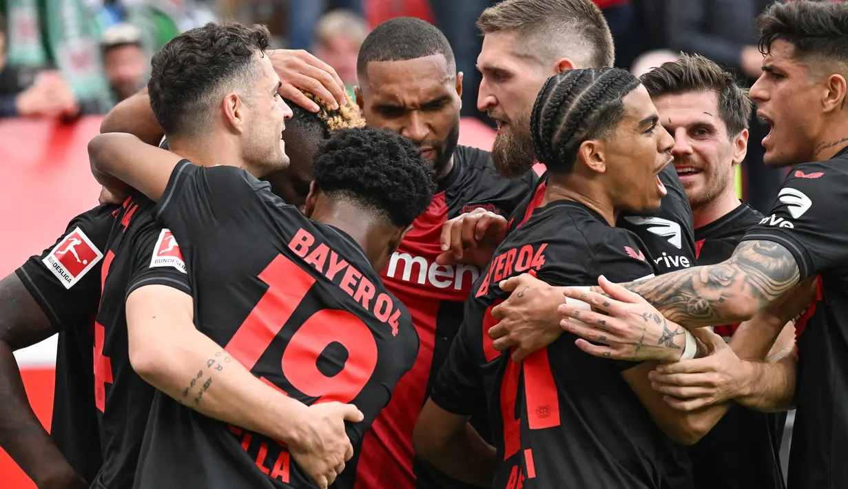 Kelima gol kemenangan Bayer Leverkusen disarangkan Victor Boniface pada menit ke-25, Granit Xhaka menit ke-60, dan hattrick Florian Wirtz pada menit ke-68, 83', serta 90'. (INA FASSBENDER / AFP)