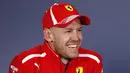 Pembalap Ferrari Sebastian Vettel dari Jerman tersenyum saat konferensi pers setelah memenangkan balapan pertama musim ini di Grand Prix Formula Satu Australia di Melbourne, (25/3). (AP Photo / Asanka Brendon Ratnayake)