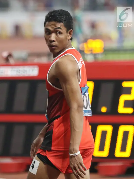 Pelari cepat Indonesia, Lalu Muhammad Zohri usai kualifikasi lari 100 meter Asian Games 2018 di Stadion GBK, Jakarta, Sabtu (25/8). Lalu M Zohri mencatat waktu 10,27 detik dan berhak tampil di semifinal. (Liputan6.com/Helmi Fithriansyah)
