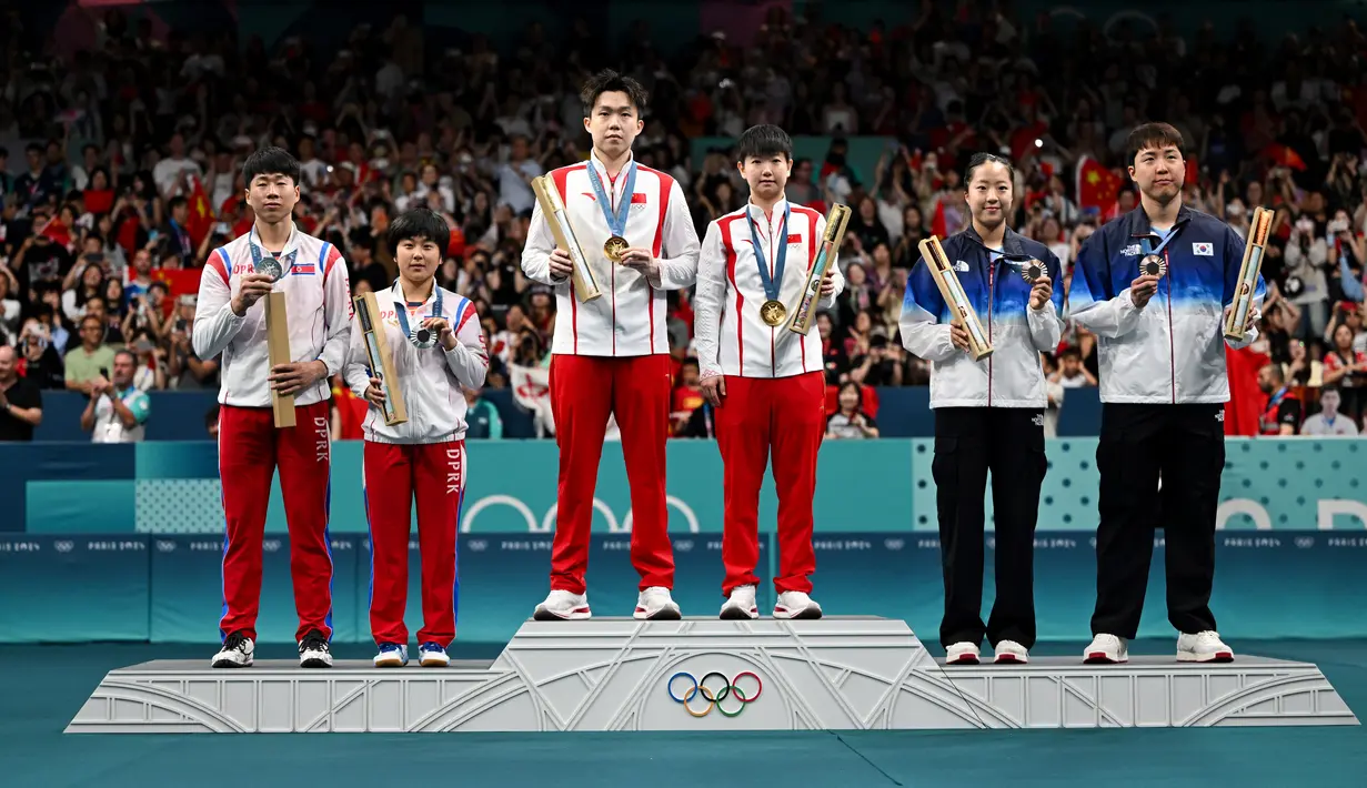 Ini adalah pertama kalinya Korea Utara berada di podium Olimpiade sejak 2016, karena mereka tidak mengirim atlet ke Olimpiade Tokyo lantaran pandemi Covid-19. (JUNG Yeon-je / AFP)