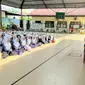 Ratusan siswa-siswi SMAN 1 Bangkinang, Kabupaten Kampar, mengikuti sosialisi pemilih pemula dalam pemilihan umum bersama Polres Kampar. (Liputan6.com/M Syukur)