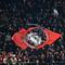 Fans AC Milan memberikan dukungan kepada timnya saat laga leg pertama perempat final Liga Champions 2022/2023 melawan Napoli di San Siro, Milan, Kamis (13/04/2023) dini hari WIB. Pertandingan tersebut berhasil dimenangkan oleh tuan rumah melalui gol tunggal Ismael Bennacer. (AFP/Gabriel Bouys)