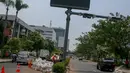 Uji coba ERP dimulai dengan sinkronisasi gerbang elektronik terhadap alat on board unit (OBU) yang dipasang di beberapa mobil yang dijadikan sampel, Jakarta, Senin (22/9/2014) (Liputan6.com/Faizal Fanani)