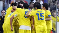 Vllarreal's players celebrate a goal scored in the last minute against Barcelona during their Spanish League football match on May 10, 2009 at Camp Nou stadium in Barcelona. The match ended with a 3-3 draw. AFP PHOTO/ LLUIS GENE 