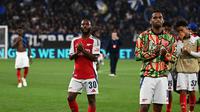 Ekspresi bintang Arsenal, Raheem Sterling (kiri) selepas pertandingan kontra Atalanta  pada matchday pertama Liga Champions 2024/2025, di Stadion Atleti Azzurri d'Italia, Jumat (20/9/2024) dini hari WIB. (Isabella Bonotto/AFP)