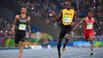 Andre De Grasse (kiri) merupakan peraih medali perak nomor 200 meter dan medali perunggu nomor 100 meter serta nomor 4x100 meter pada Olimpiade Rio 2016 lalu. Dengan pensiunnya Bolt (tengah), dirinya diprediksi akan sabet medali emas pada Olimpiade Tokyo 2020 ini. (Foto: AFP/Olivier Morin)