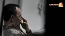 Ketegangan tampak terlihat di wajah Hambit saat menjalani sidang di Pengadilan Tipikor yang beragendakan pembacaan putusan (Liputan6.com/Johan Tallo)