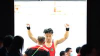 Rahmat Erwin Abdullah beraksi di SEA Games 2021. Ia mempertahankan medali emas di nomor 78 kg. (Bola.com/Ikhwan Yanuar Harun)