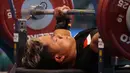 Atlet cabor angkat berat 45 kg putra asal Jawa Barat, Prasetyo Tamim, dalam Pekan Paralimpiade Nasional (Peparnas) XVII di Solo, Jawa Tengah, Selasa (8/10/2024). Tamim berhasil meraih medali emas setelah mengalahkan rekannya satu timnya. (PB PEPARNAS XVII/Andry Prasetyo)