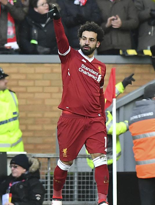 Bintang Liverpool, Mohamed Salah menjadikan persaingan top scorer Liga Champions semakin berwarna. Hinggal babak 16 besar Salah sudah mengoleksi enam gol. (Anthony Devlin/PA via AP)