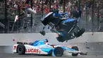 Scott Dixon melayang diudara usai tertabrak Jay Howard saat balapan Indianapolis 500 di Indianapolis Motor Speedway (28/5). Insiden terjadi saat Jay Howard keluar dari lajur balap hingga menabrak Scott Dixon. (Ron Graphman/The Indianapolis Star via AP)
