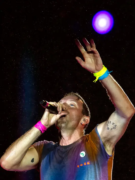 <p>Vokalis dari band rock Inggris Coldplay, Chris Martin tampil pada festival musik Rock in Rio di Rio de Janeiro, Brasil, Minggu (11/9/2022). (AP Photo/Bruna Prado)</p>