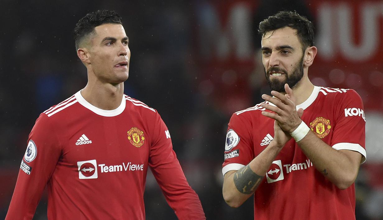Manchester United berhasil memetik poin penuh saat menjamu Brighton pada laga lanjutan Liga Inggris di Old Trafford, Rabu (16/02/2022) dini hari WIB. Duo Portugis, Cristiano Ronaldo dan Bruno Fernandes masing-masing mencetak gol kemenangan Setan Merah. (Foto kolase: AP/Rui Viera)