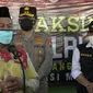 Ketua PWNU Jatim, KH Marzuqi Mustamar mengajak seluruh masyarakat di Jawa Timur tak ragu dengan vaksin Covid-19 karena halal dan aman (Liputan6.com/Zainul Arifin)