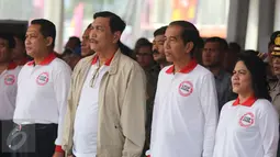 Presiden Joko Widodo dan Ibu Negara Iriana Jokowi serta Kepala BNN, Komjen Budi Waseso (kiri). Menko Polhukam Luhut Binsar Pandjaitan saat hadiri peringatan HANI 2016 di kawasan Taman Sari, Jakarta, Minggu (26/06). (Liputan6.com/ Herman Zakharia)
