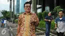 Hakim PN Jakarta Utara Dahlan meninggalkan Gedung KPK usai menjalani pemeriksaan, Jakarta, Jumat (22/7). Sebanyak empat Hakim PN Jakarta Utara diperiksa sebagai saksi atas tersangka Samsul Hidayatullah. (Liputan6.com/Helmi Afandi)