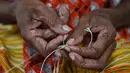 <p>Papua memiliki tas tradisional yang dikenal dengan noken. Sementara, Papua Nugini juga memiliki tas tradisional yang disebut dengan bilum. (ADEK BERRY/AFP)</p>