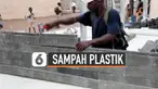Sebuah LSM Kolombia membuat batu bata yang dari sampah plastik daur ulang. Batu bata tersebut digunakan untuk membuat sekolah di Abidjan, Pantai Gading.