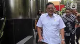 Kepala Badan Pangan Nasional (Bapanas) Arief Prasetyo Adi berjalan meninggalkan Gedung Merah Putih Komisi Pemberantasan Korupsi (KPK) di Jakarta, Jumat (2/2/2024).  (Liputan6.com/Herman Zakharia)