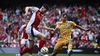 Declan Rice pada pertandingan antara Arsenal kontra Brighton di ajang Liga Inggris 2024/2025. (BENJAMIN CREMEL / AFP)