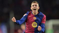 Pemain Barcelona, Fermin Lopez melakukan selebrasi setelah mencetak gol ke gawang Valencia pada laga lanjutan Liga Spanyol 2024/2025 di Estadi Olimpic Lluis Companys, Barcelona, Spanyol, Senin (27/01/2025) dini hari WIB. (AFP/Manaure Quintero)