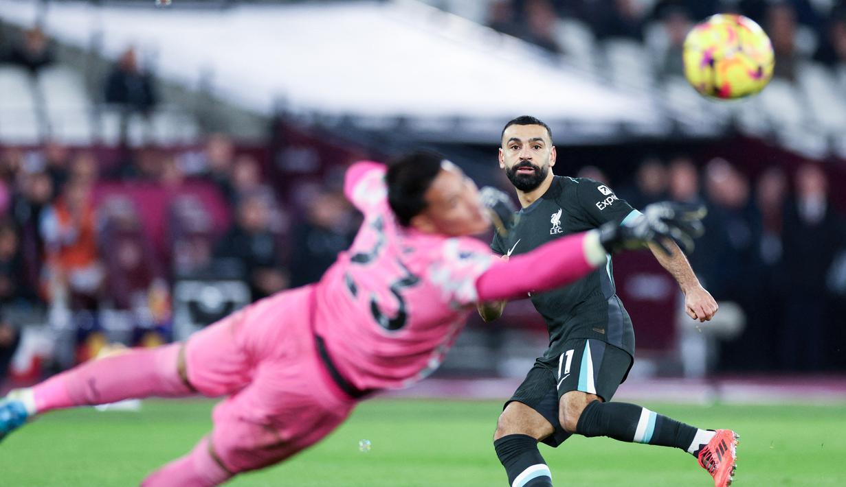 Liverpool sukses melibas West Ham United lima gol tanpa balas pada laga lanjutan Liga Inggris 2024-2025 di London Stadium pada Minggu (29/12/2024). (AFP/Adrian Dennis)