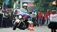 Polwan pun ikut ambil bagian dalam kontes ketangkasan mengendarai motor besar (Liputan6.com/Danu Baharuddin)
