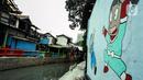 Mural menghiasi Kampung Unggulan, Tanah abang, Jakarta, Selasa (6/12/2022). Pembuatan mural sepanjang 100 meter di kampung unggulan tersebut sudah dilakukan awal november 2022 dan program dari Pemerintah Provinsi DKI Jakarta. (Liputan6.com/Johan Tallo)