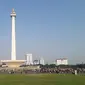Monumen Nasional (Monas) ramai dikunjungi warga saat libur sekolah (Liputan6.com/Komarudin)