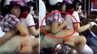 Seorang pria tampak meremas payudara putrinya sendiri di atas sepeda motor yang berhenti di lampu merah