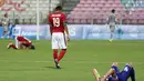 Ekspresi kontras pemain Indonesia U-23 dengan pemain Filipina U-23 setelah pertandingan. (Bola.com/Arief Bagus)
