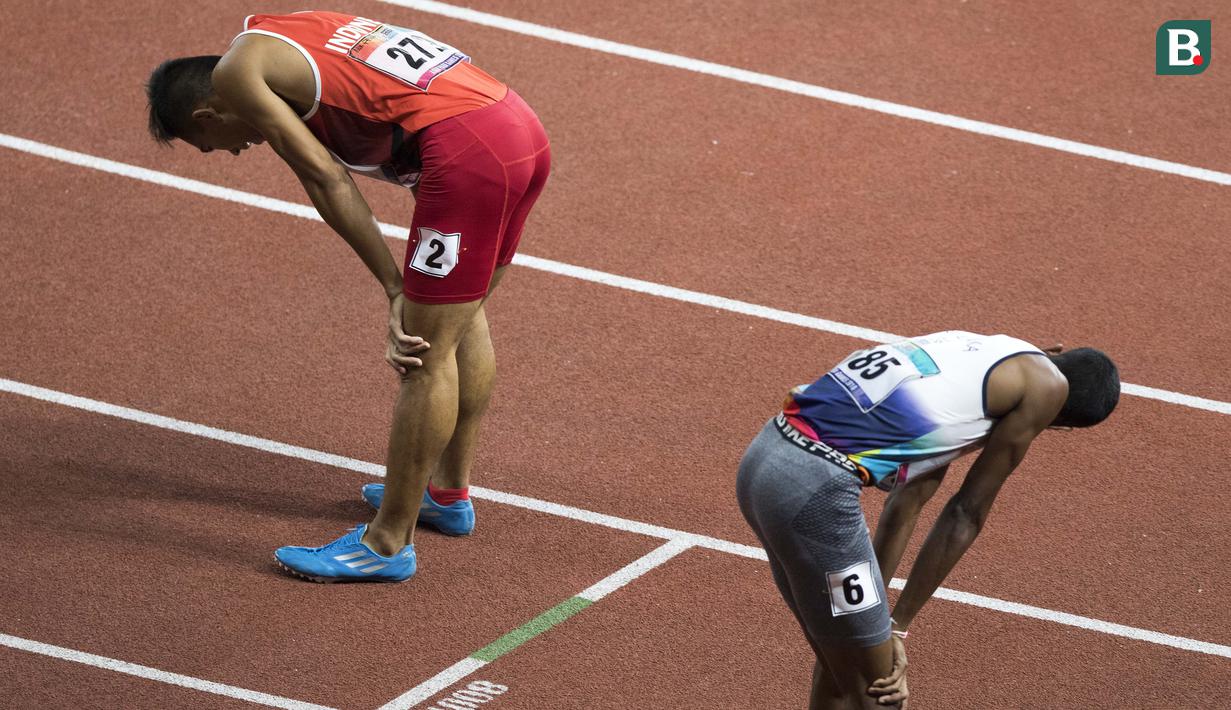 Ferry Pradana meraih medali perak di cabang para atletik nomor lari 400 meter putra klasifikasi T45/46/47 pada Asian Para Games 2018, di Stadion Utama Gelora Bung Karno Jakarta, Kamis(11/10/2018).  (Bola.com/Peksi Cahyo)