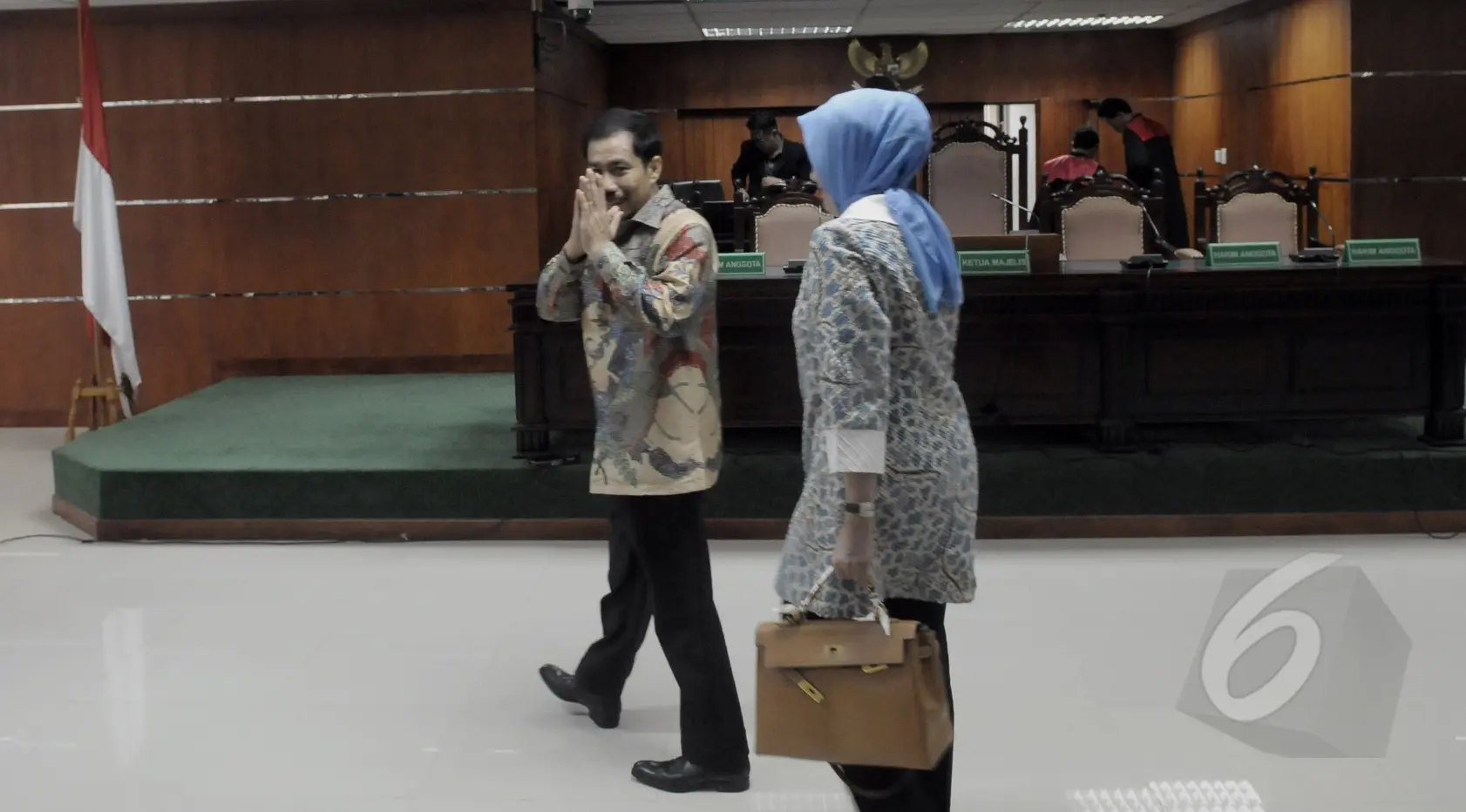 Hakim memberikan vonis karena Romi Herton dan istri terbukti menyuap Akil Mochtar, Pengadilan Tipikor, Jakarta, Senin (9/3/2015). (Liputan6.com/Andrian M Tunay)
