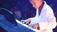 Canho, pianis cilik berusia 11 tahun sudah mampu memainkan lebih dari 30 lagu-lagu piano klasik. (Foto: Dokumentasi Kris Jambru)