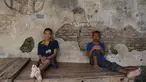 Dua orang pria yang dipasung di yayasan Bina Lestari Mandiri, Brebes, Jawa Tengah (16/3). Mereka terpaksa dipasung karena menderita penyakit mental. (Adek BERRY / AFP )