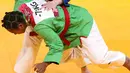 Atlet beladiri Kurash Indonesia, Marselina Papara saat bertarung dengan Munkhtstsg Ogon dari Monggolia di 16 besar kelas putri dibawah 78 kg di JCC Senayan, Jakarta, Kamis (30/8). Indonesia kalah 0-10 dari Monggolia. (Liputan6.com/Fery Pradolo)
