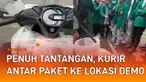 Aksi seorang kurir paket antar barang lewati lokasi demo menarik perhatian