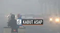 Warga Palembang kembali harus bertahan dengan kondisi kabut asap yang menyelimuti kotanya akibat masih adanya hutan yang terbakar di sekitar Sumtera Selatan.