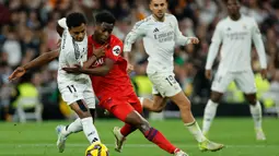 Bermain di hadapan pendukung sendiri, Real Madrid sukses membungkam Sevilla dengan skor 4-2. (OSCAR DEL POZO/AFP)