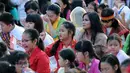 Sejumlah anak-anak bersiap mengikuti gelaran Harmoni Indonesia 2018 di Kompleks Gelora Bung Karno, Jakarta, Minggu (5/8). Harmoni Indonesia adalah bernyanyi bersama secara serentak lagu-lagu kebangsaan di 34 kota. (Liputan6.com/Helmi Fithriansyah)