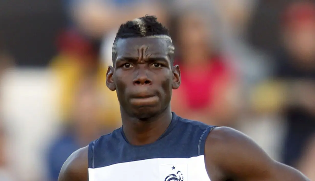 Gelandang Timnas Perancis, Paul Pogba, tampil dengan rambut berwarna saat berlaga di Piala Dunia 2014. (REUTERS/Sergio Perez) 